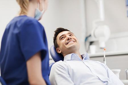 a patient smiling at his dentist